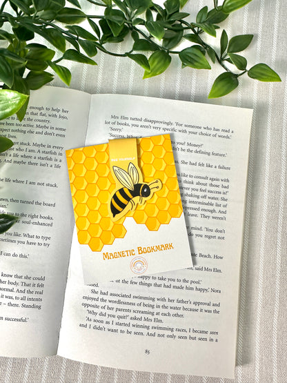 bee magnetic bookmark on book with card