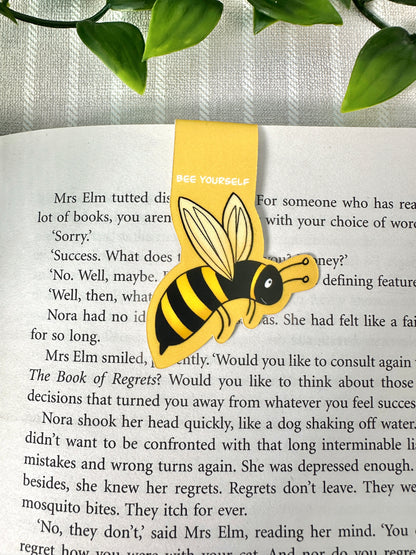 bee magnetic bookmark on the page close up