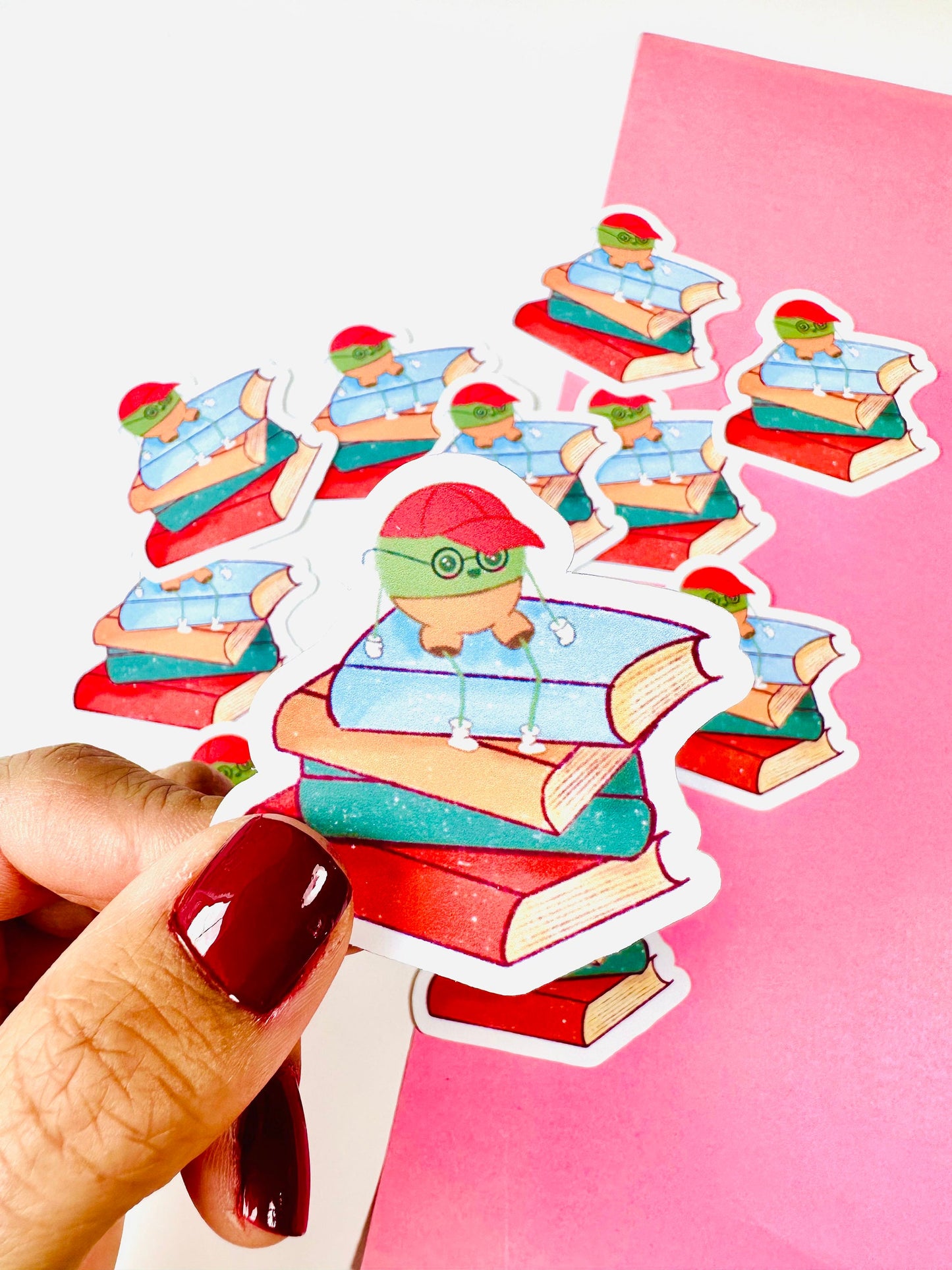 Mr Pea on Stack of books vinyl sticker close up