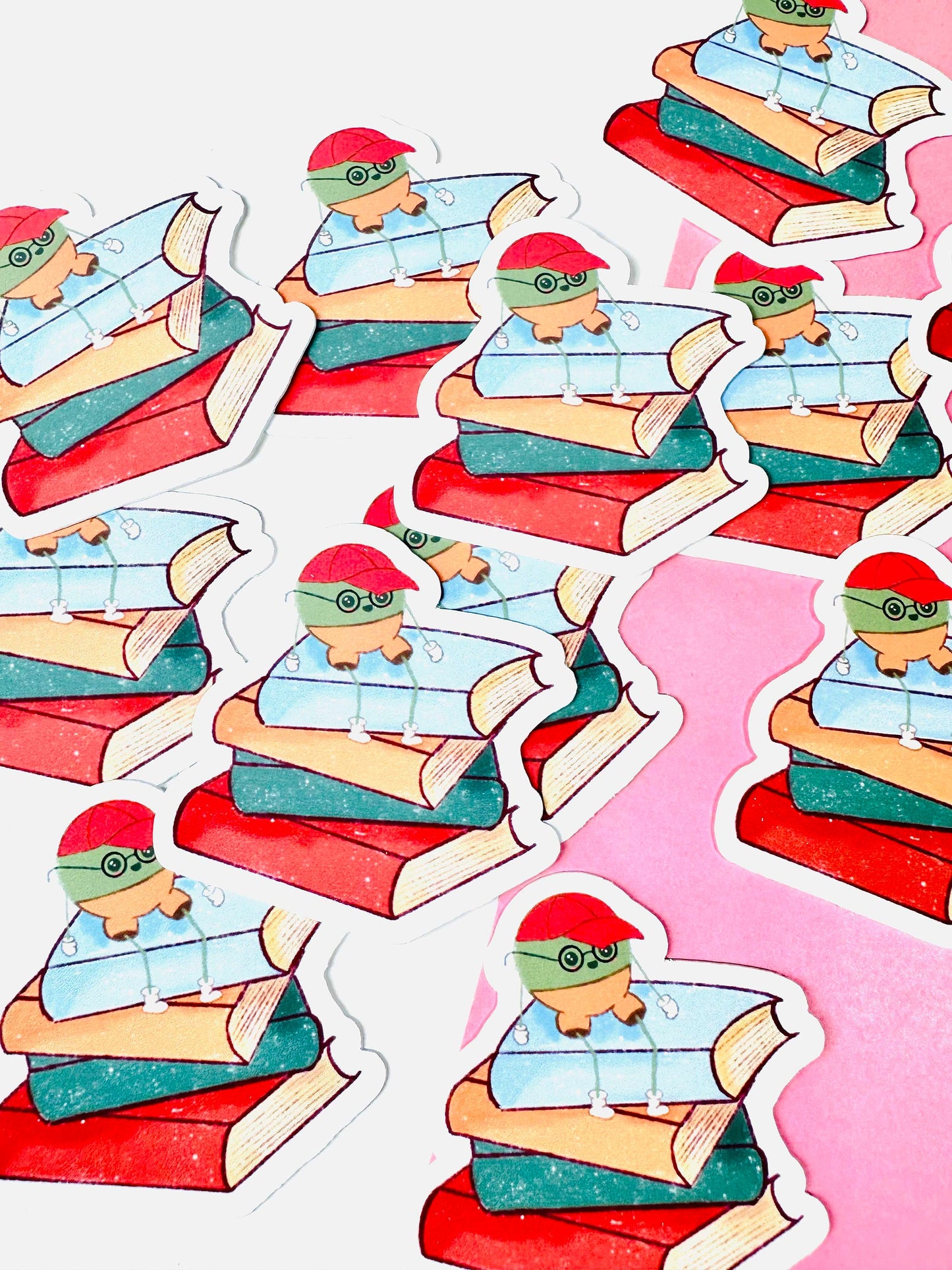 Mr Pea on Stack of books vinyl sticker in a group