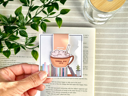 latte coffee magnetic bookmark held up with packaging