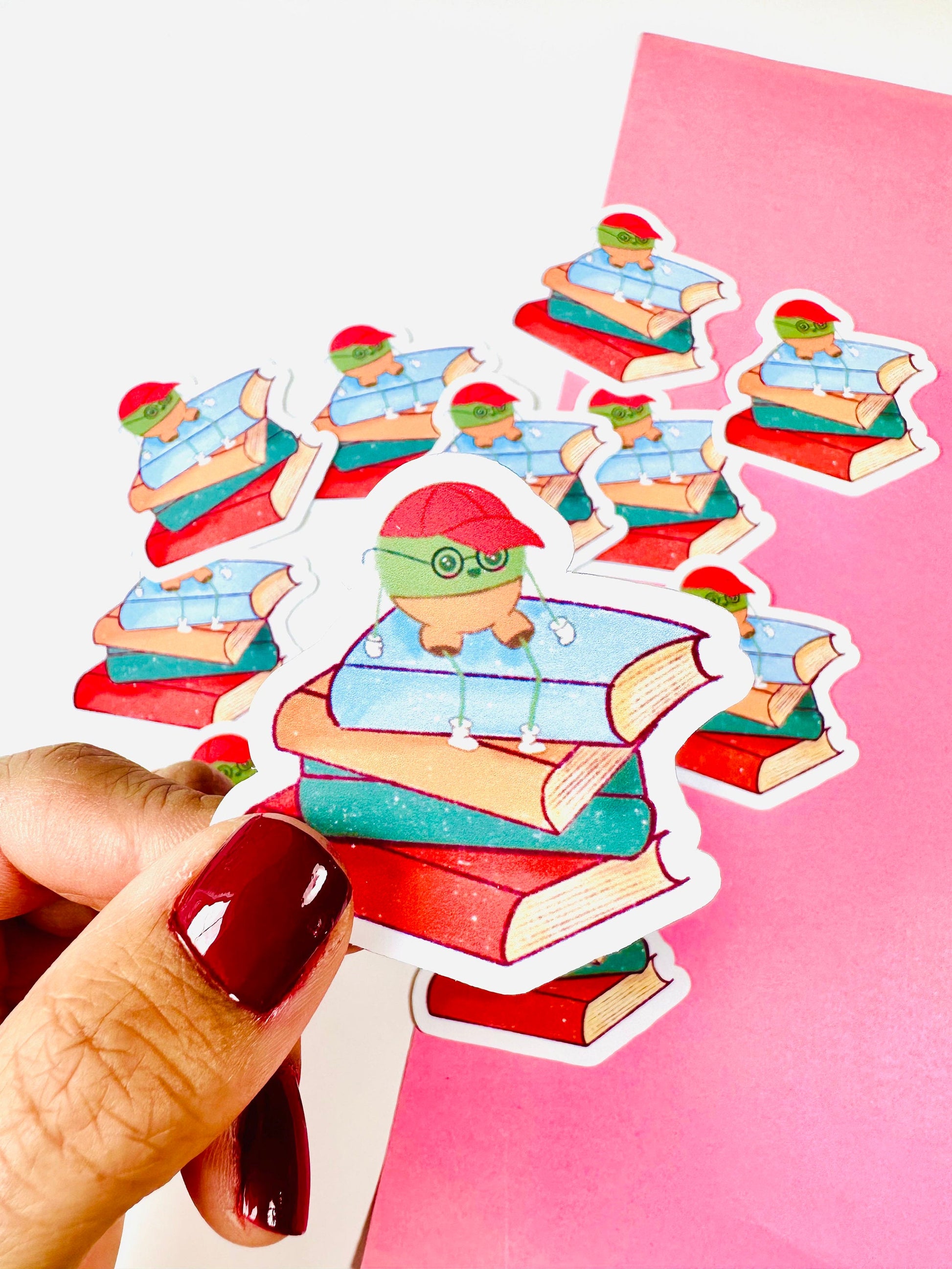 Mr Pea on Stack of books vinyl sticker close up